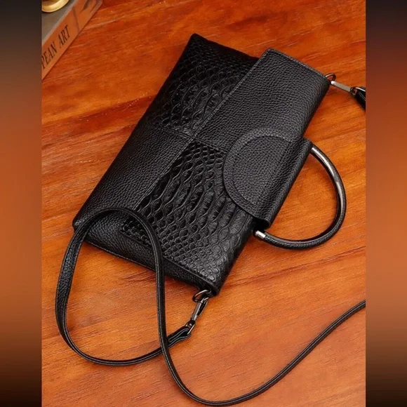 Black snakeskin print vegan leather clutchcrossbody bag